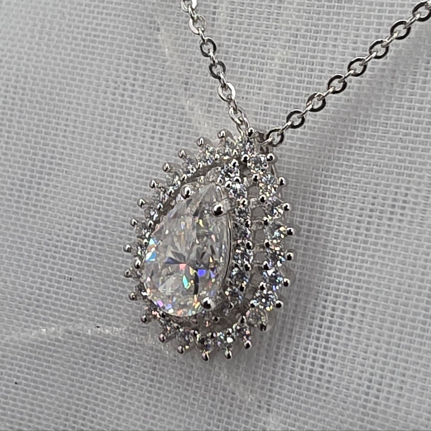1 Ctw Moissanite Pear with 2x halo
