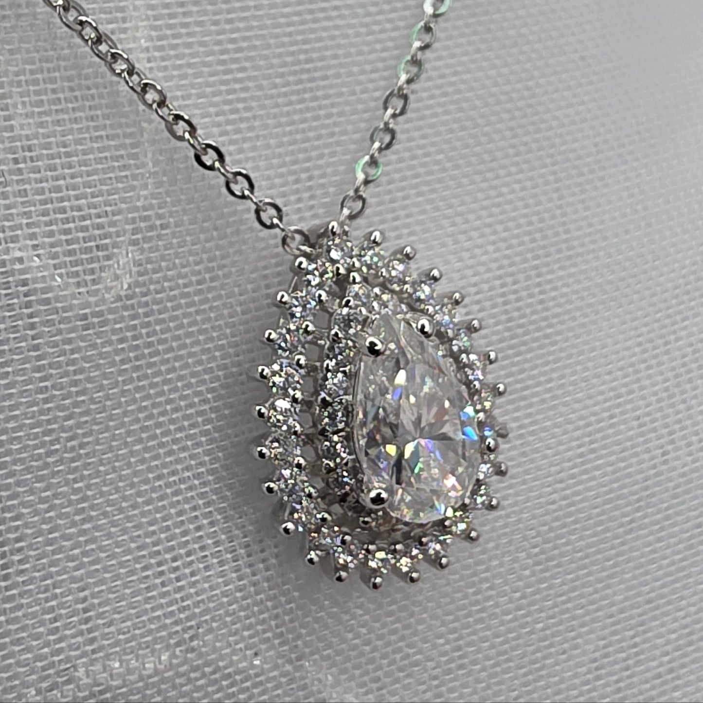 1 Ctw Moissanite Pear with 2x halo