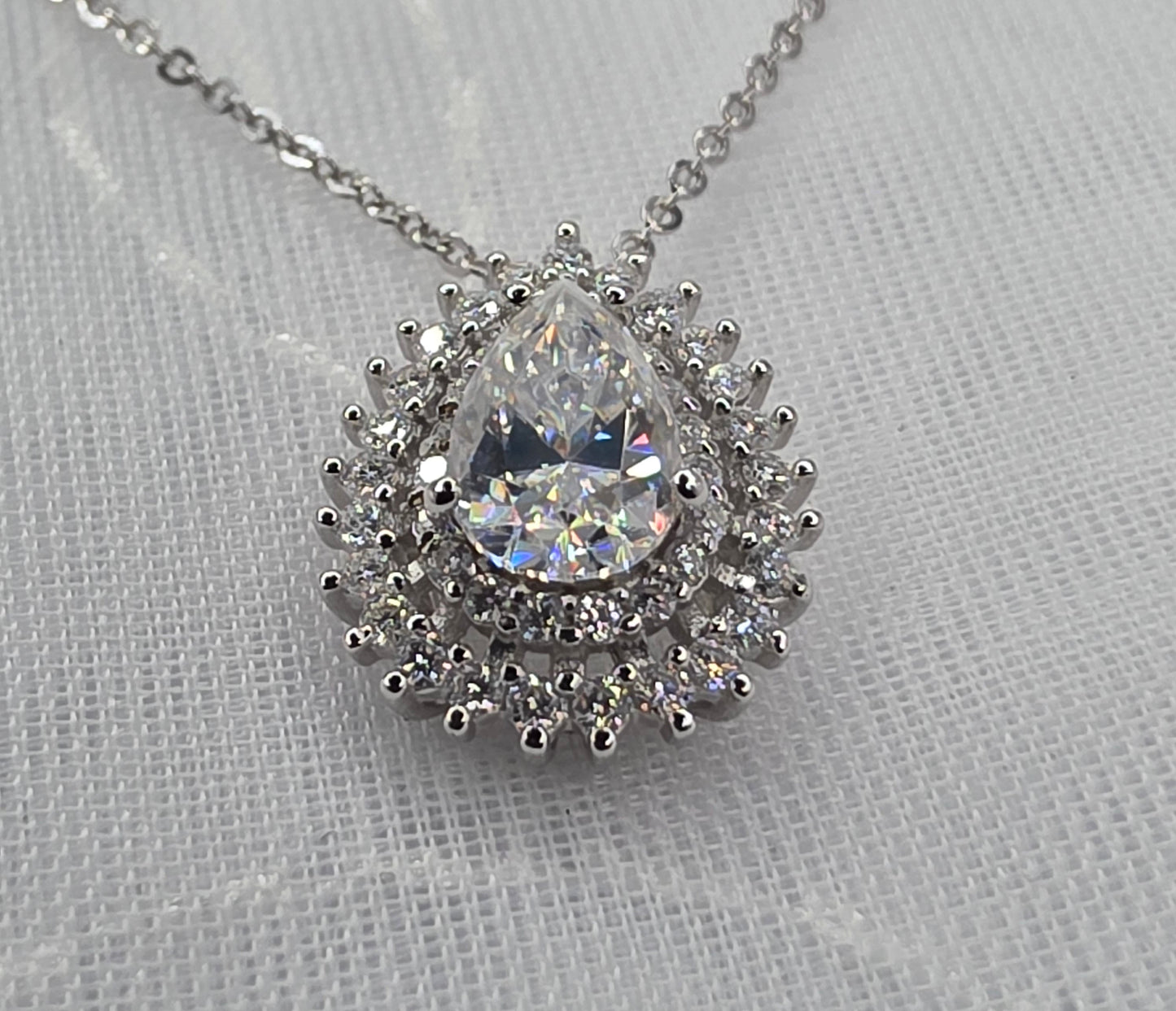 1 Ctw Moissanite Pear with 2x halo
