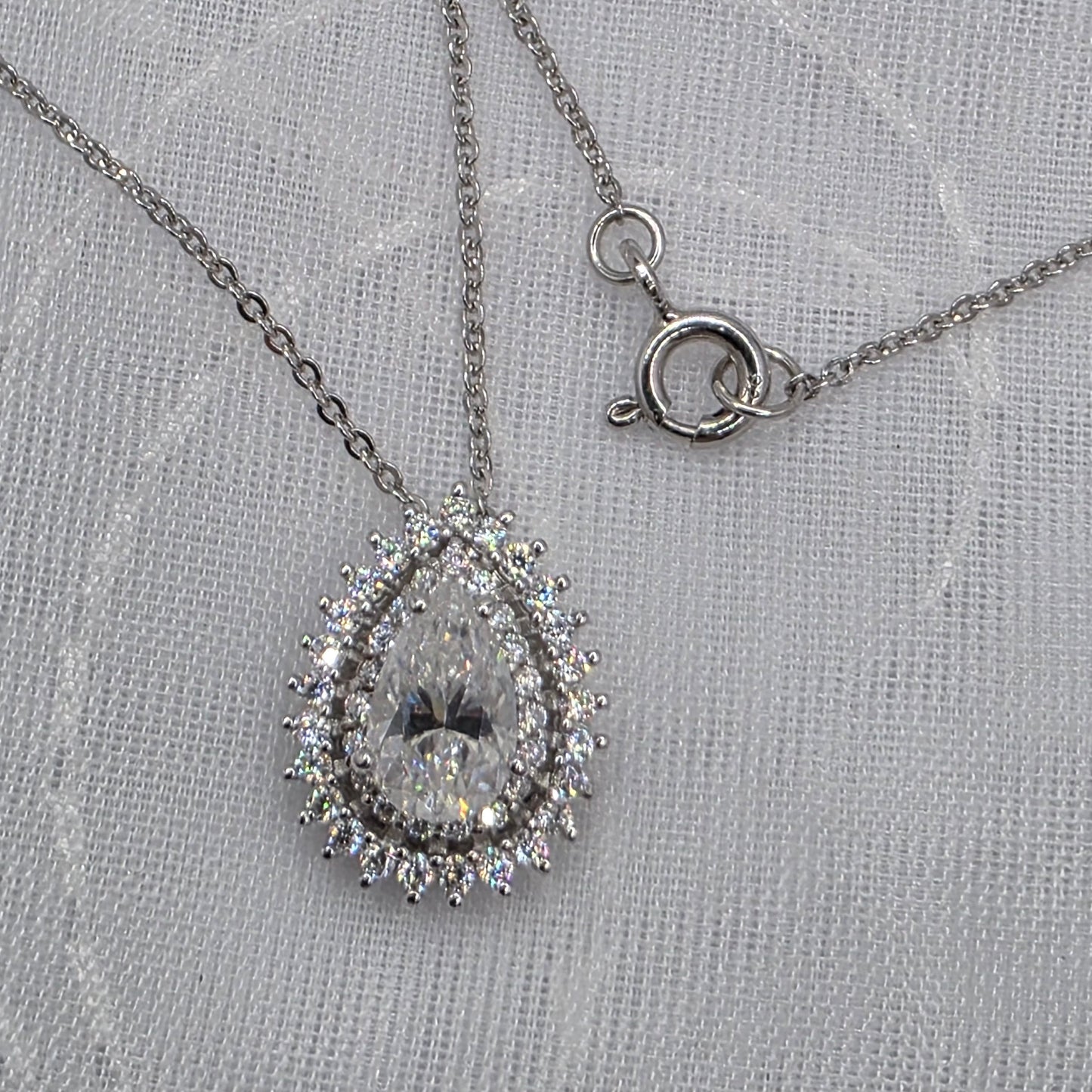 1 Ctw Moissanite Pear with 2x halo